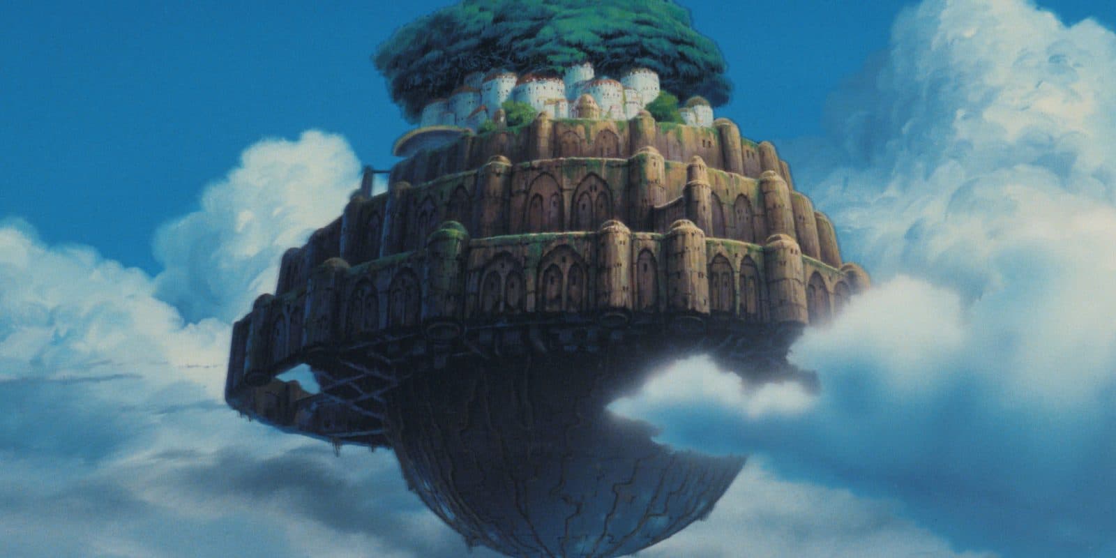 still from Castle in the Sky: the floating castle of Laputa drifting above the clouds