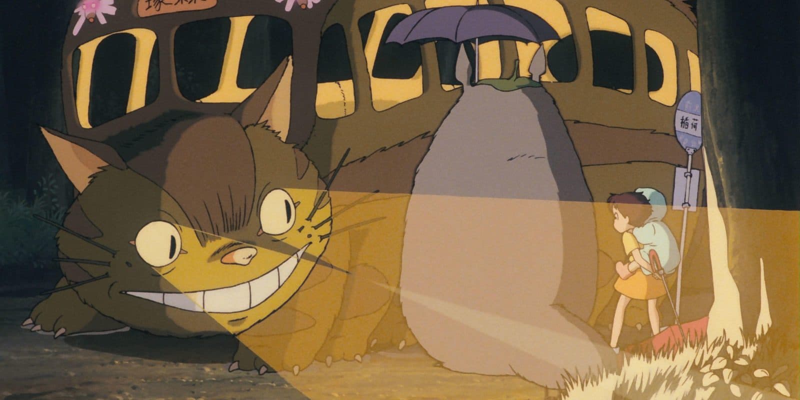 still from My Neighbor Totoro: the Catbus arriving at the bus stop in the rain